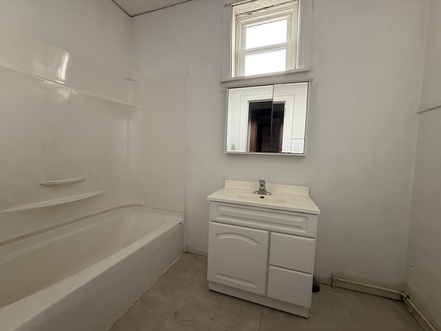 123 West St Paul Street Spring Valley, IL 61362 - Photo 21 of 28 a bathroom with a sink a vanity and a bathtub