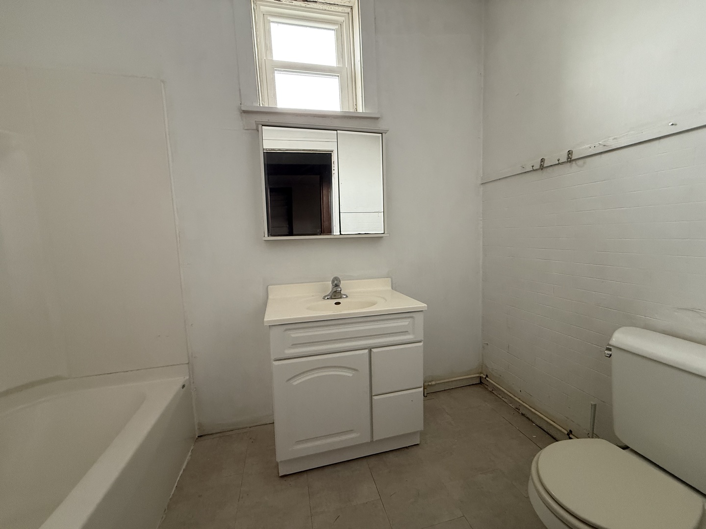 123 West St Paul Street Spring Valley, IL 61362 - Photo 22 of 28 a bathroom with a sink a toilet and a bathtub