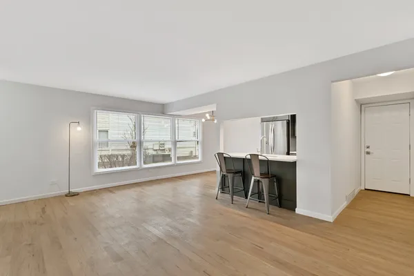 a view of a livingroom with furniture and wooden floor