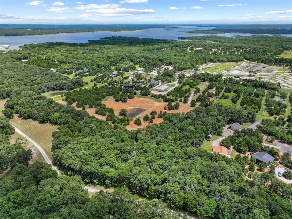 1445 Cedar Mills Road Gordonville, TX 76245 - Photo 13 of 28 Expansive acreage featuring abundant mature trees, multiple clearings, and water feature