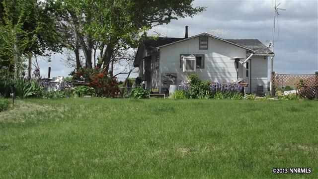 a front view of house with garden