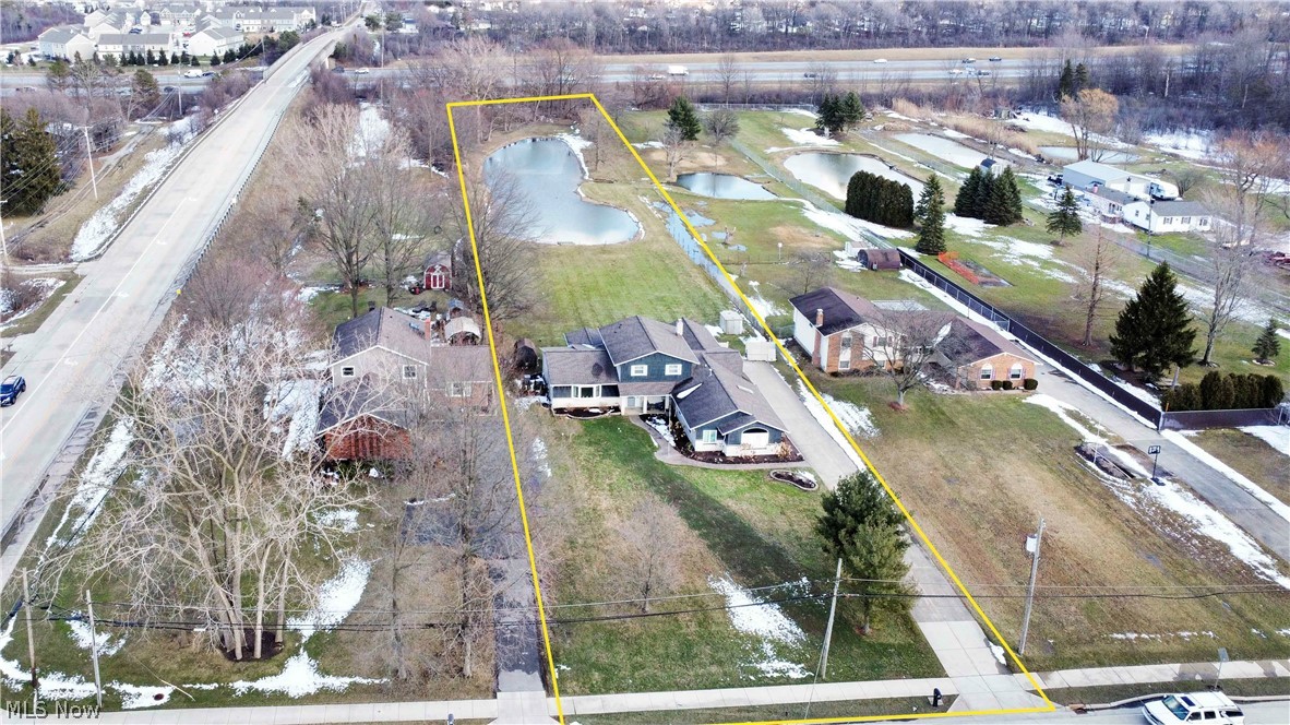 563 North Carpenter Road Brunswick, OH 44212 - Photo 36 of 45 Aerial perspective of suburban area with a large body of water and property parcel outlined
