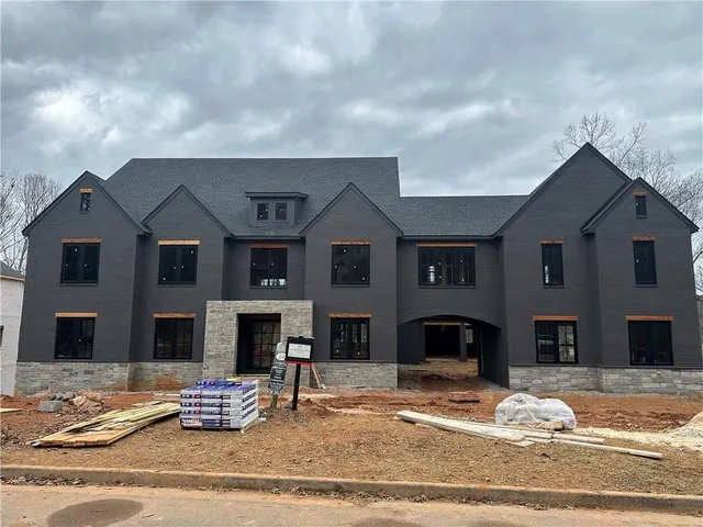 a front view of a house with yard