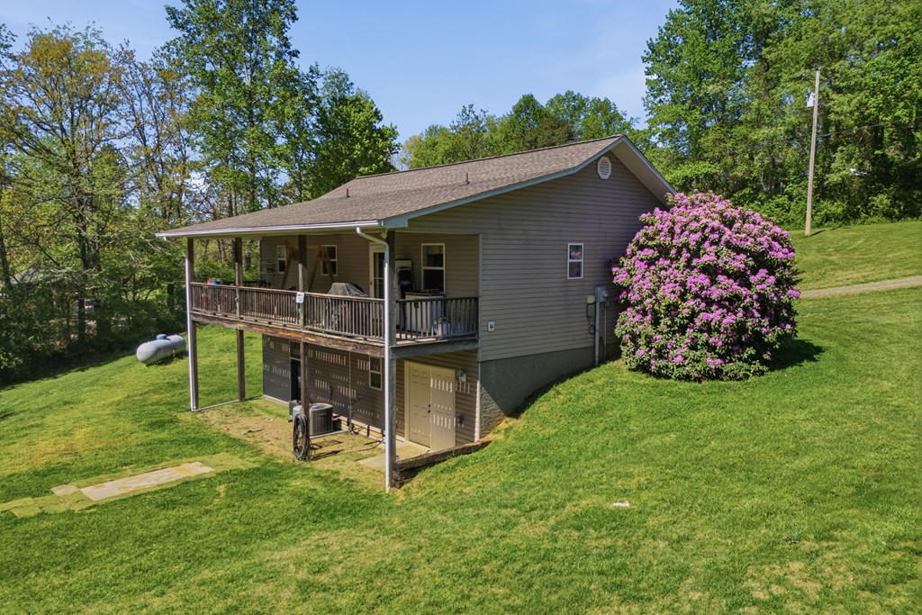 68 West Vineyard Road Hayesville, NC 28904 - Photo 12 of 46 a house view with a garden space