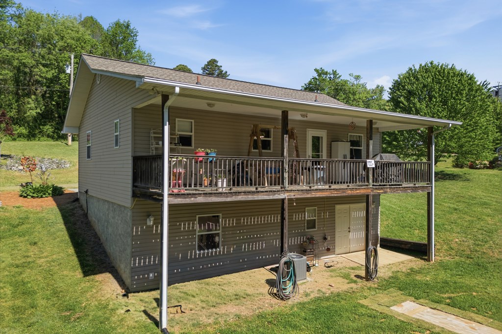 68 West Vineyard Road Hayesville, NC 28904 - Photo 13 of 46 a view of house with backyard porch and furniture