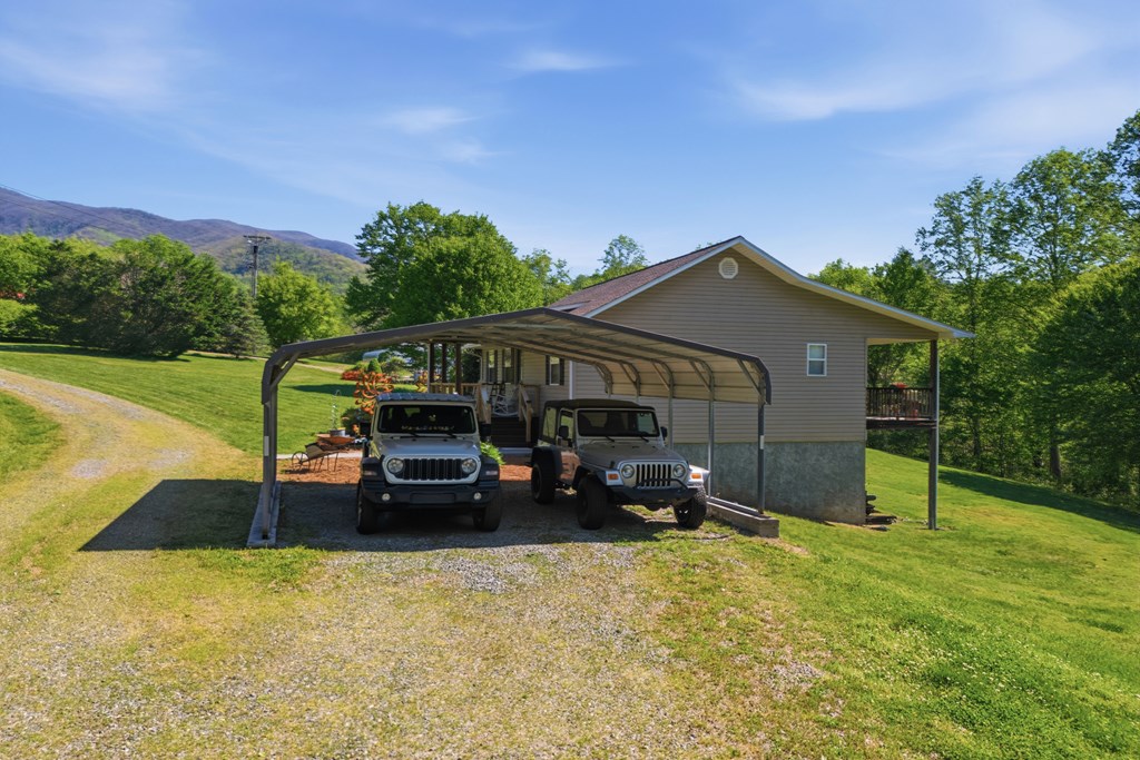 68 West Vineyard Road Hayesville, NC 28904 - Photo 16 of 46 a view of a house with a yard