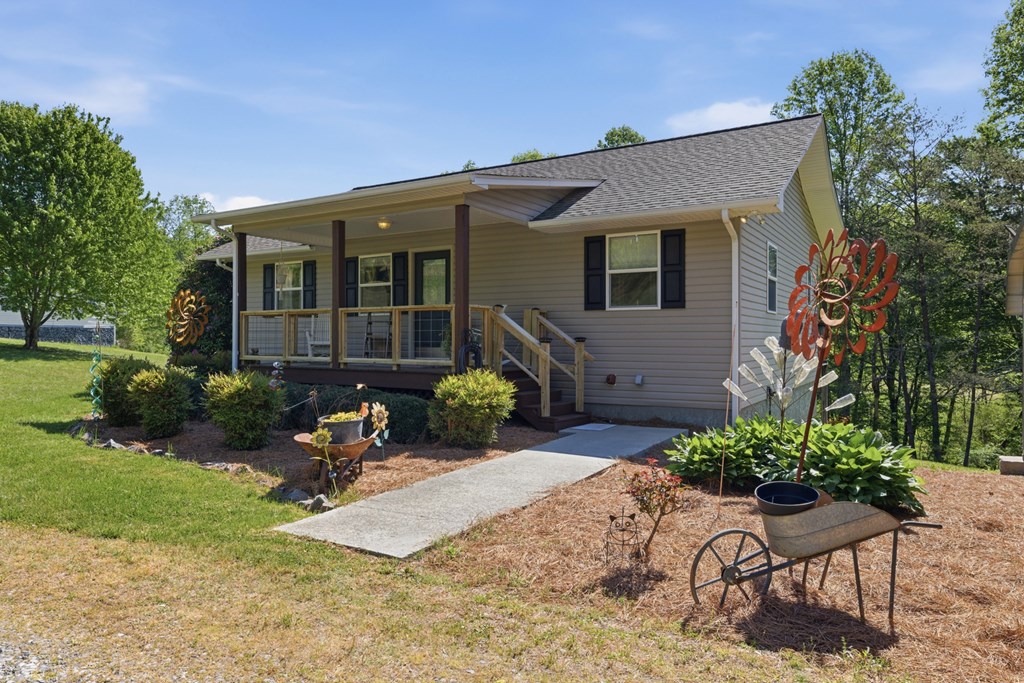 68 West Vineyard Road Hayesville, NC 28904 - Photo 17 of 46 a front view of a house with a yard