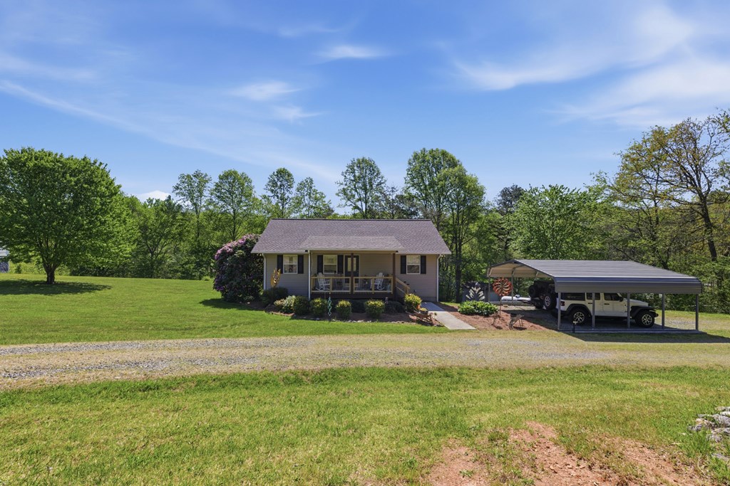68 West Vineyard Road Hayesville, NC 28904 - Photo 18 of 46 a view of a house with a yard