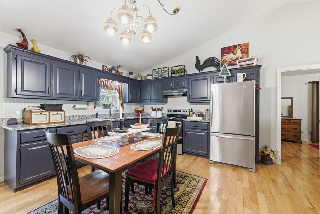 68 West Vineyard Road Hayesville, NC 28904 - Photo 25 of 46 a kitchen with refrigerator and cabinets
