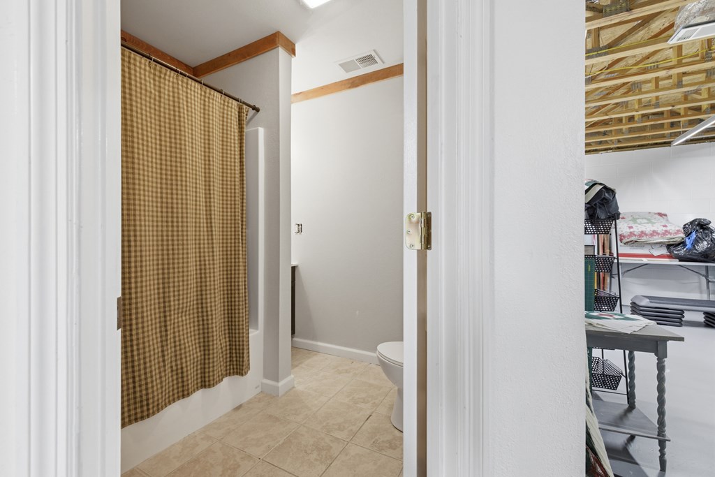 68 West Vineyard Road Hayesville, NC 28904 - Photo 39 of 46 a view of a bathroom with a shower and a sink