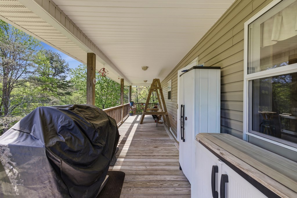 68 West Vineyard Road Hayesville, NC 28904 - Photo 45 of 46 a view of balcony with furniture and wooden floor