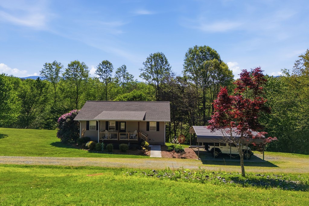 68 West Vineyard Road Hayesville, NC 28904 - Photo 9 of 46 a view of a house with a yard and sitting area