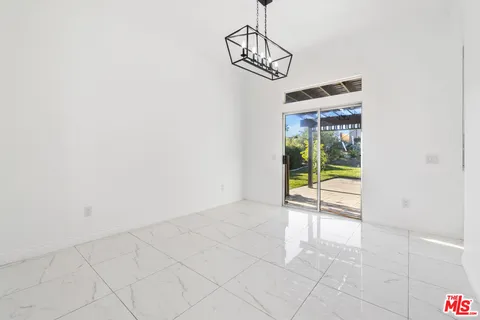 a living room with furniture wooden floor and a fireplace