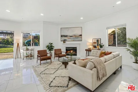 an empty room with a ceiling fan and window