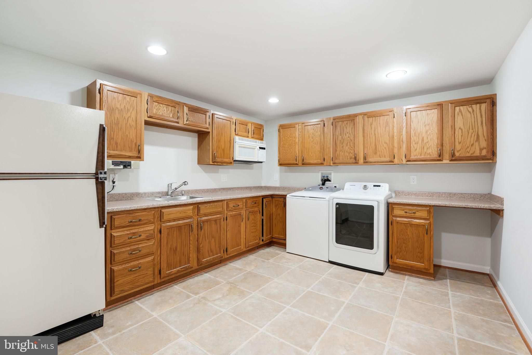 11615 Quail Ridge Court Reston, VA 20194 - Photo 52 of 64 Lower level laundry / second kitchen