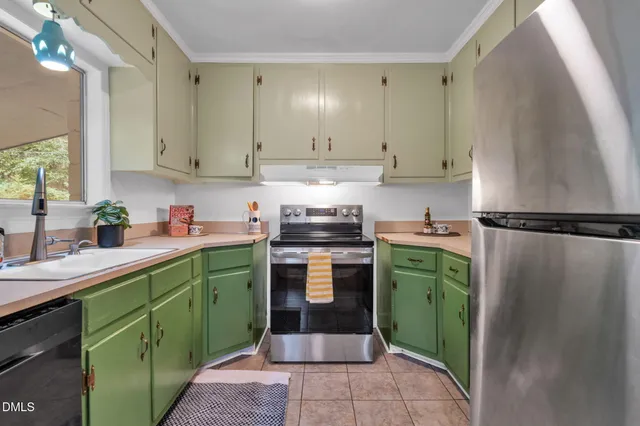 a kitchen with a refrigerator sink and stove