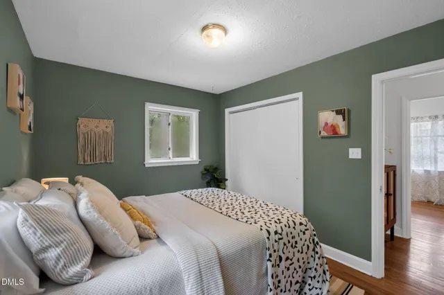 a bedroom with bed and a window