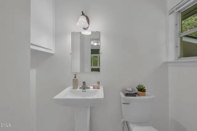 a bathroom with a sink and mirror