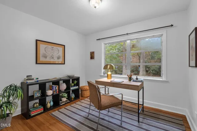 a workspace with furniture and window