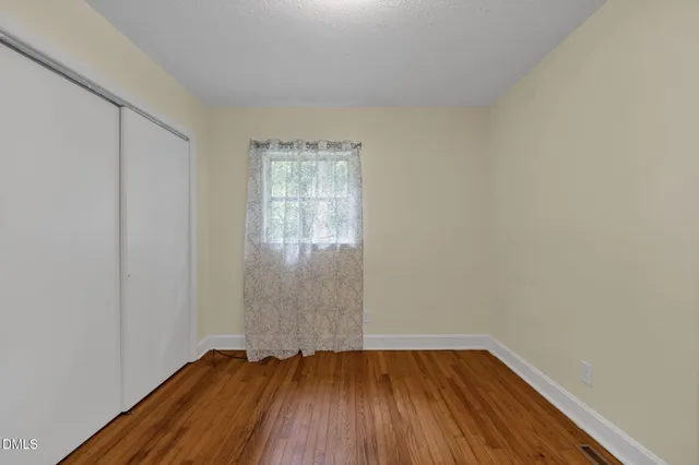 a bathroom with a bathtub sink and mirror