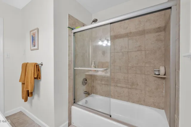 a view of a dining room with furniture and a chandelier fan