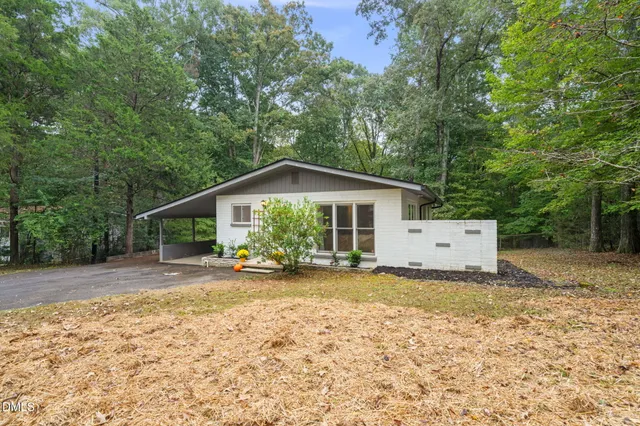 a view of a big yard with lots of green space