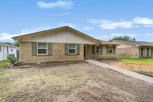a house with trees in the background