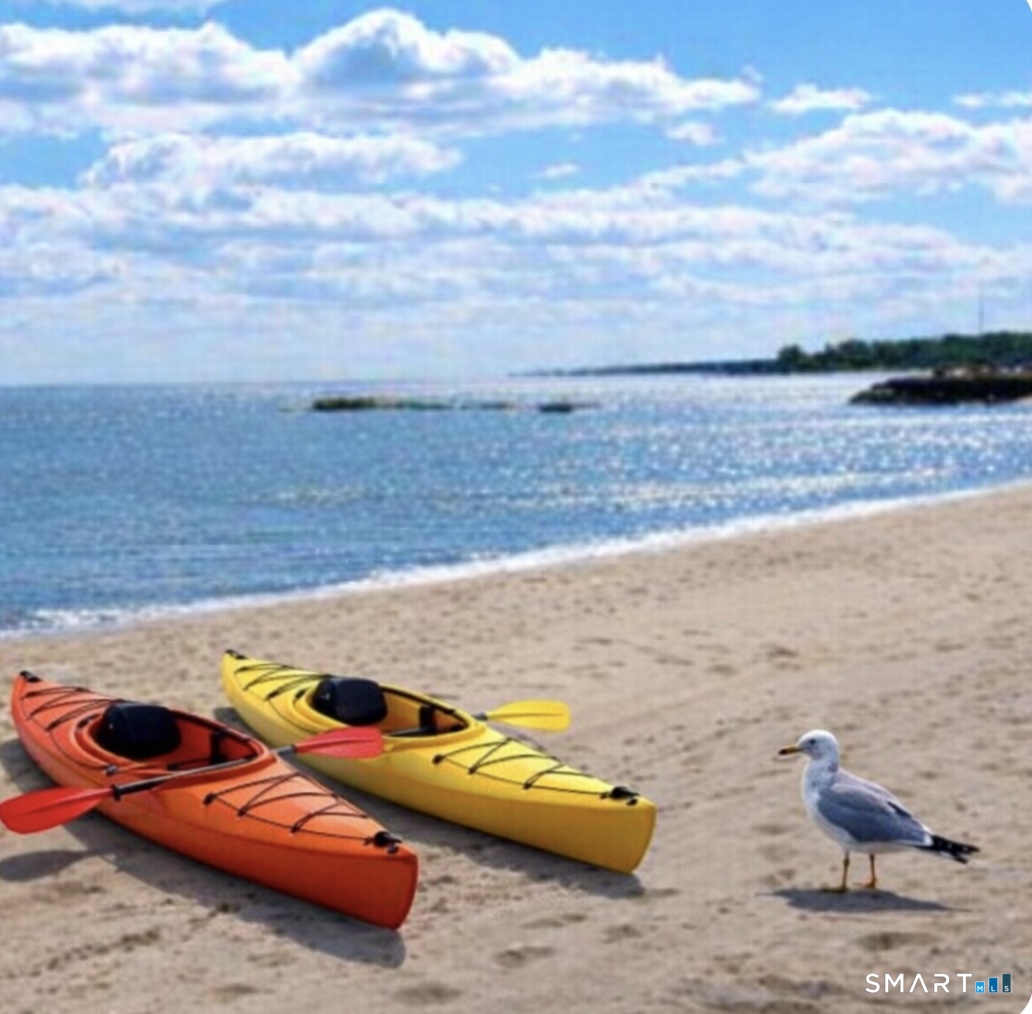 a view of a lake with lawn chairs