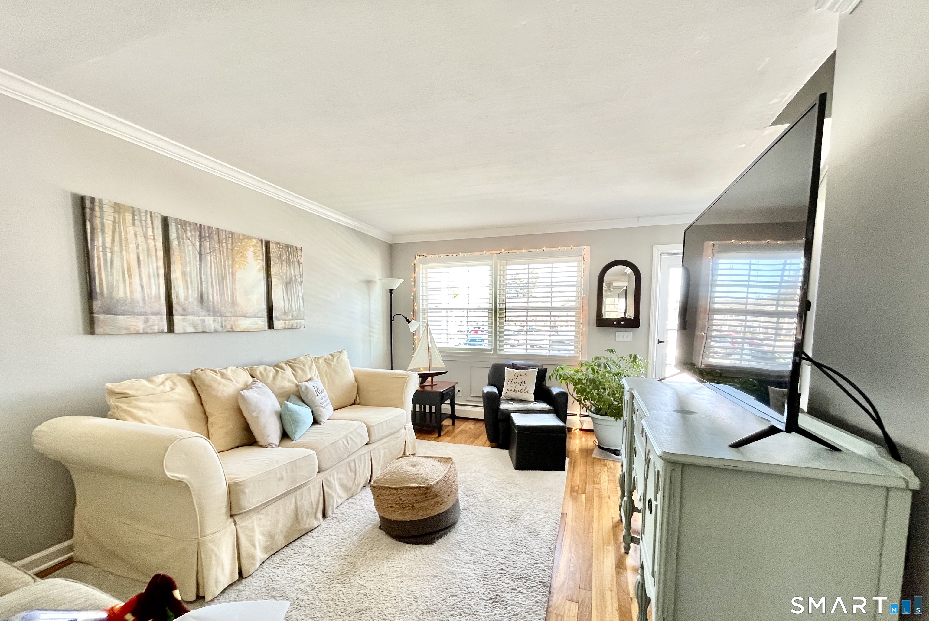 25 Riverside Drive, Unit E4 Clinton, CT 06413 - Photo 5 of 14 a living room with furniture and a large window