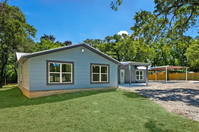 front view of a house with a yard