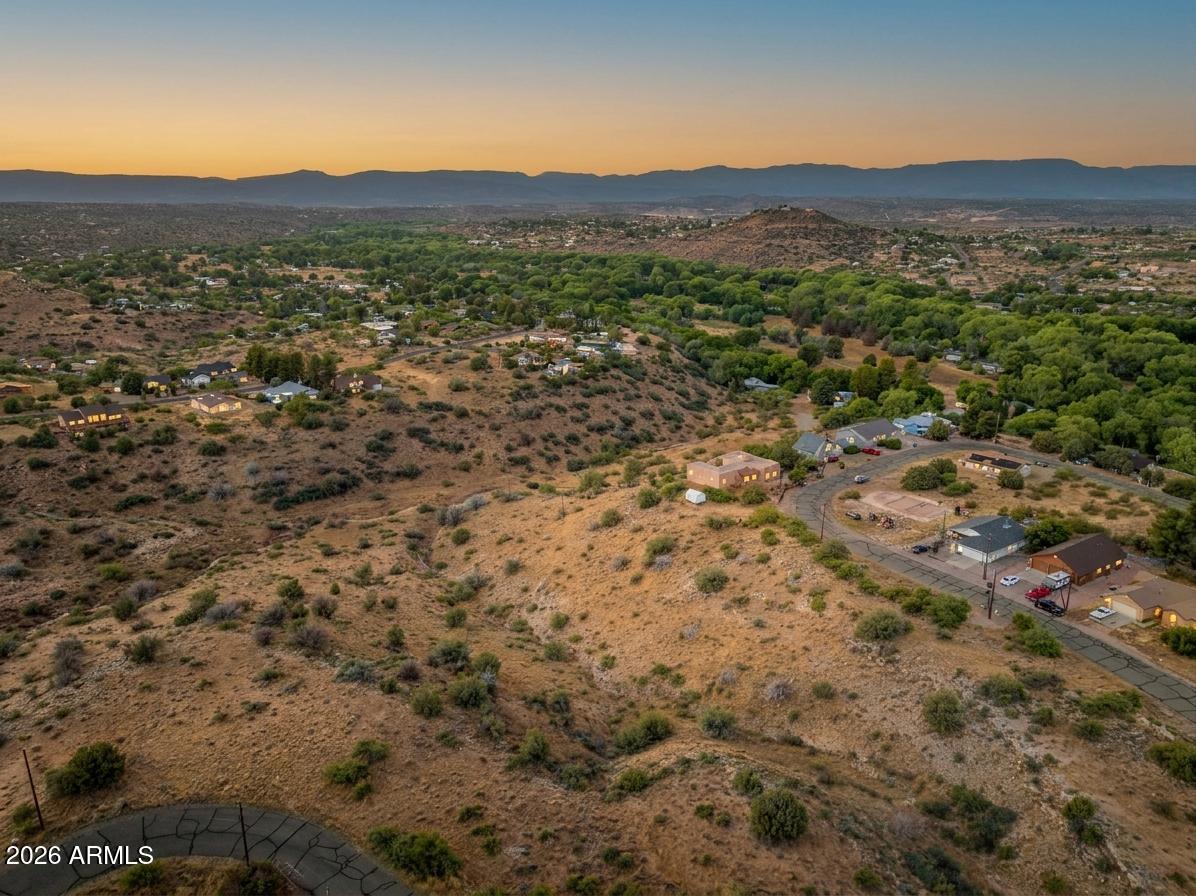 4505 Ghost Rider Way Rimrock, AZ 86335 - Photo 2 of 20 a view of a lush green field with mountains in the background