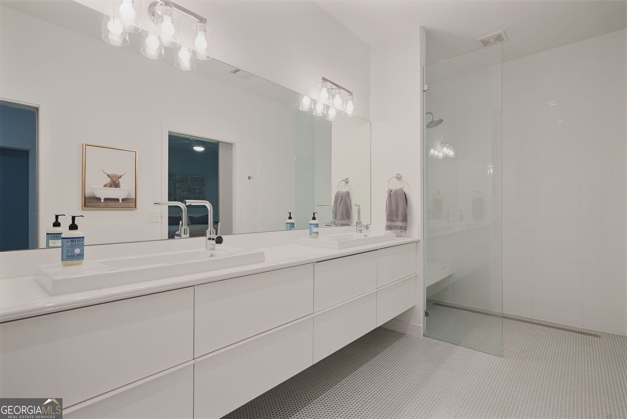235 Glades Road Eatonton, GA 31024 - Photo 52 of 79 a bathroom with a sink vanity and a mirror