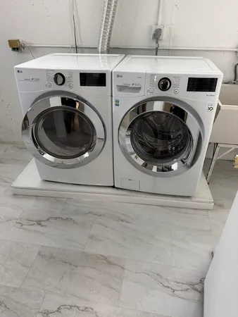 a utility room with dryer and washer