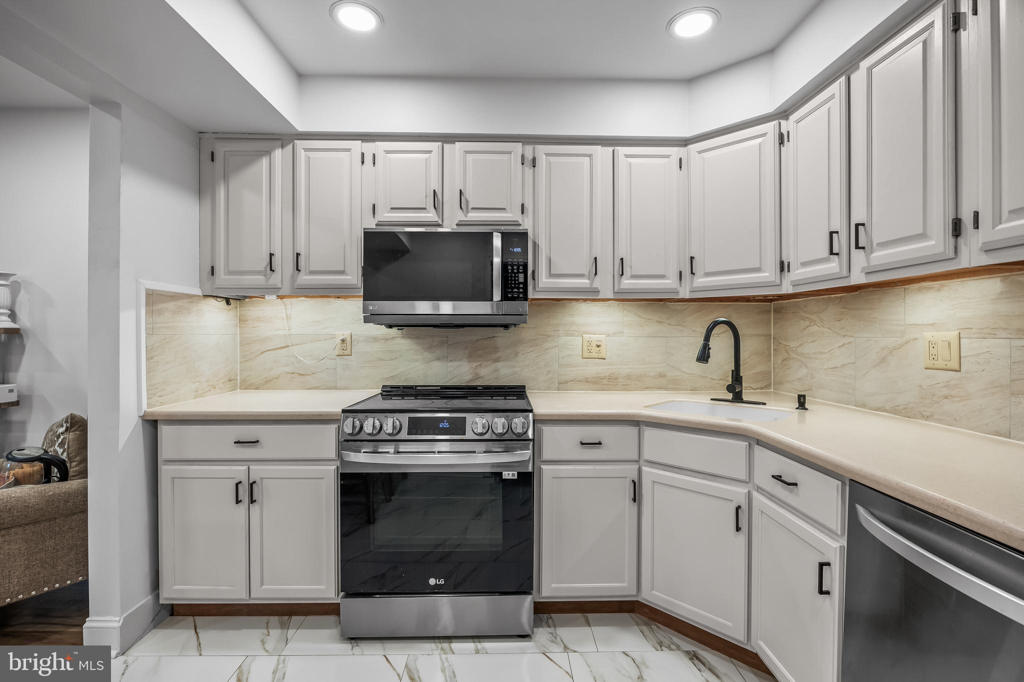 1 Neville Court Sewell, NJ 08080 - Photo 23 of 24 a kitchen with cabinets stainless steel appliances and a sink