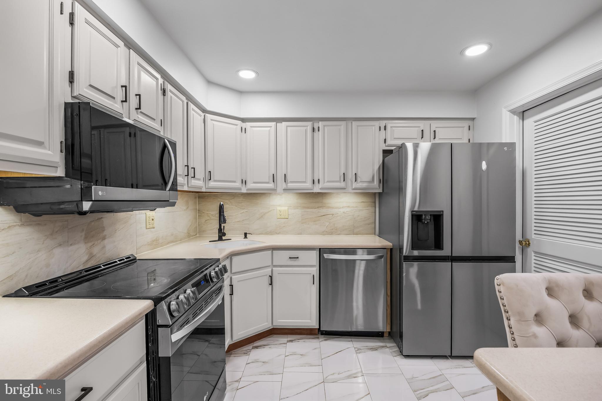 1 Neville Court Sewell, NJ 08080 - Photo 24 of 24 a kitchen with stainless steel appliances granite countertop a refrigerator a stove a sink and a microwave