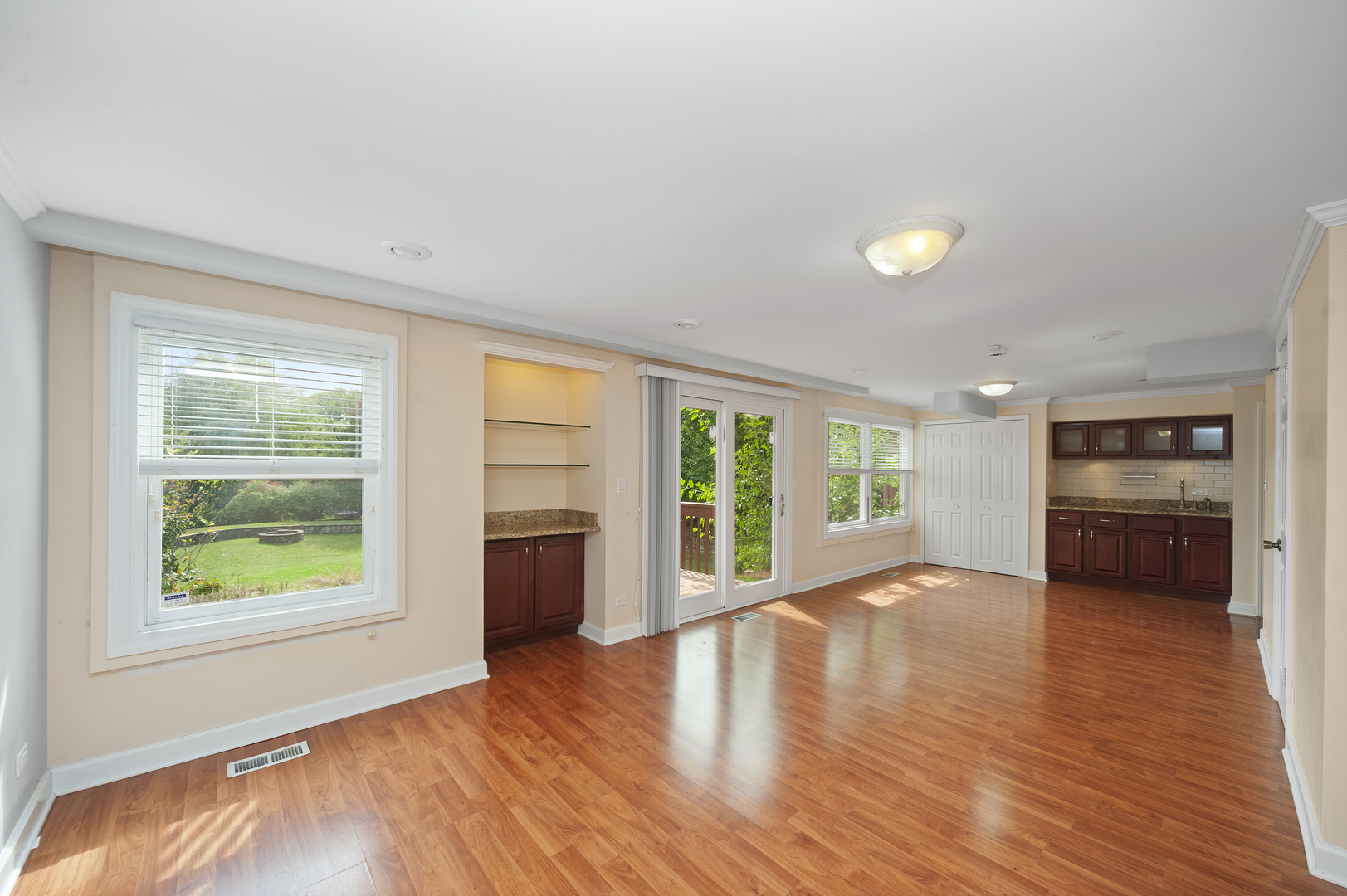 315 Spring Point Drive Carpentersville, IL 60110 - Photo 12 of 21 an empty room with windows and kitchen view