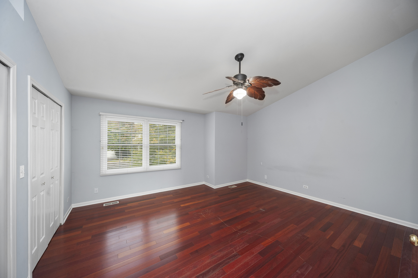 315 Spring Point Drive Carpentersville, IL 60110 - Photo 17 of 21 a view of an empty room with wooden floor and a window