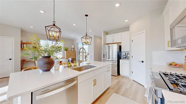 a bedroom with a large bed and a potted plant