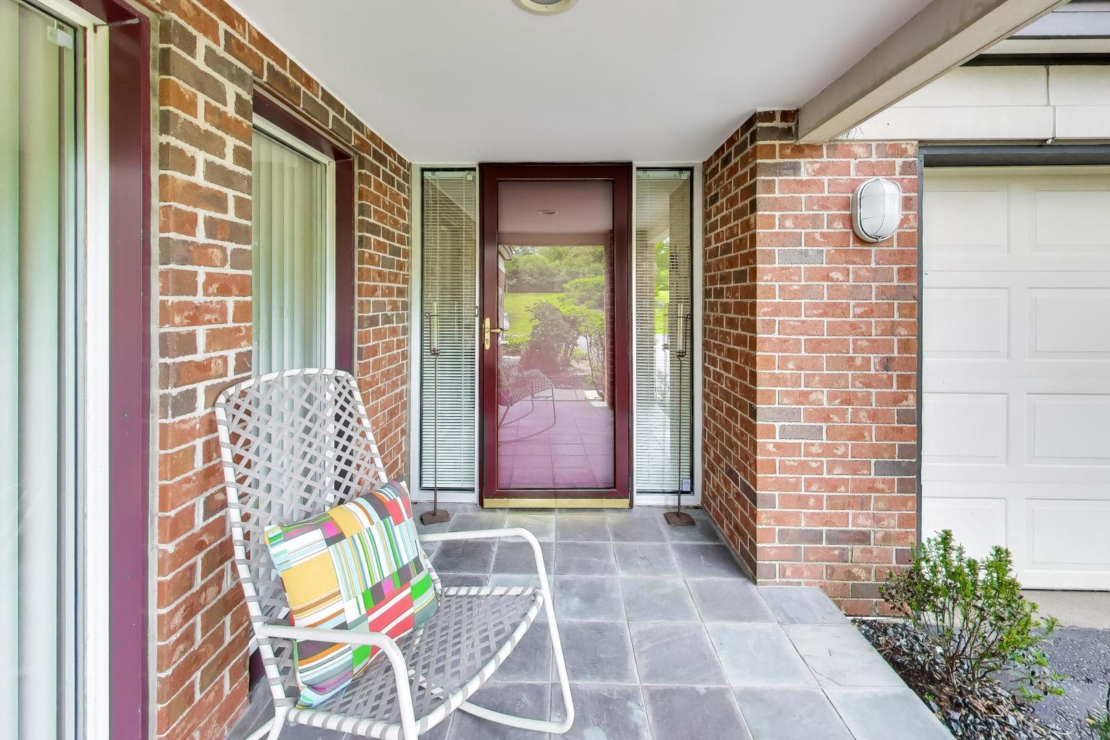 495 Milford Road Deerfield, IL 60015 - Photo 2 of 33 a front view of a house with outdoor seating