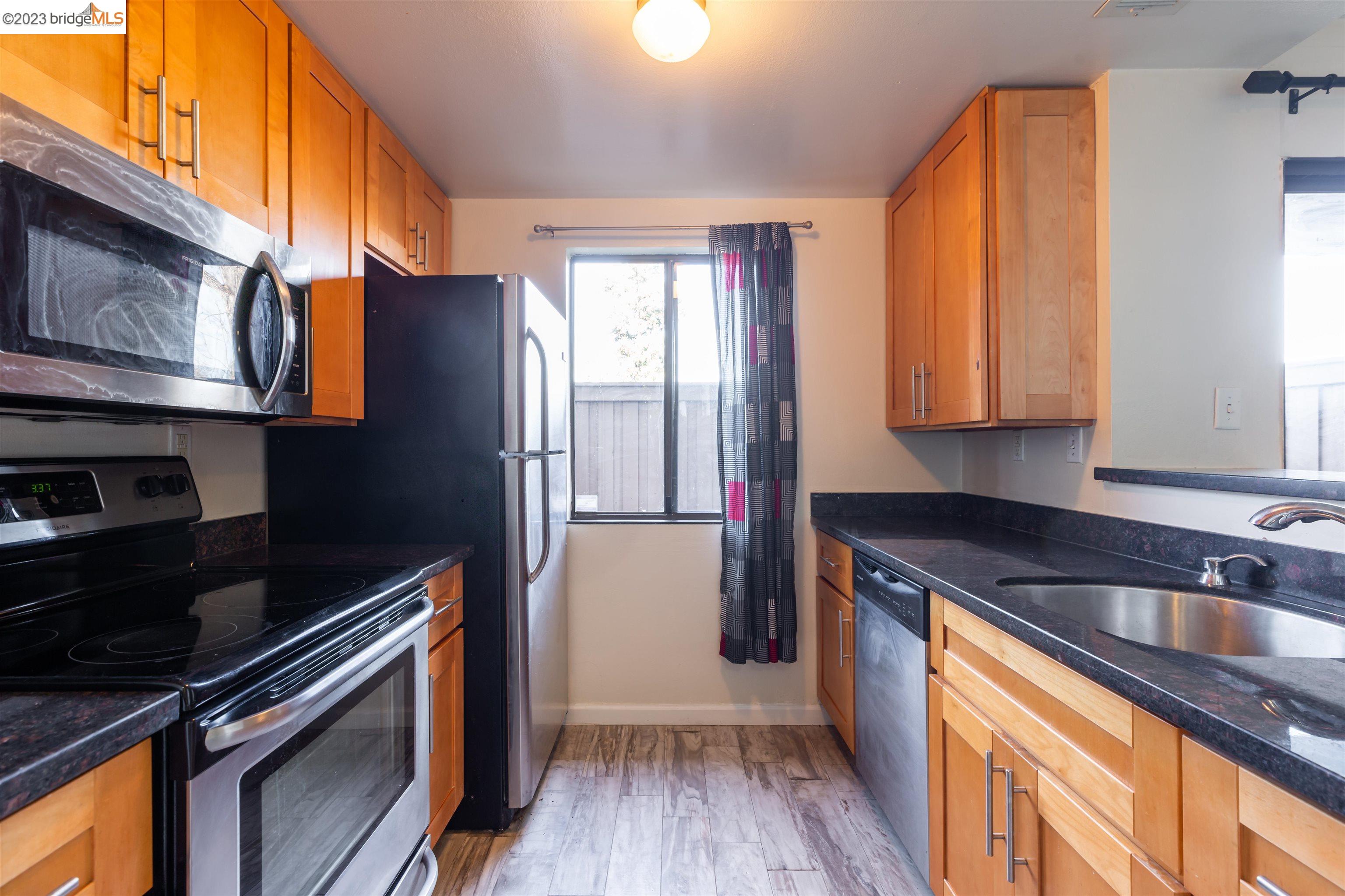 2416 Shadow Lane, Unit 75 Antioch, CA 94509 - Photo 1 of 26 a kitchen with stainless steel appliances granite countertop a refrigerator sink and stove