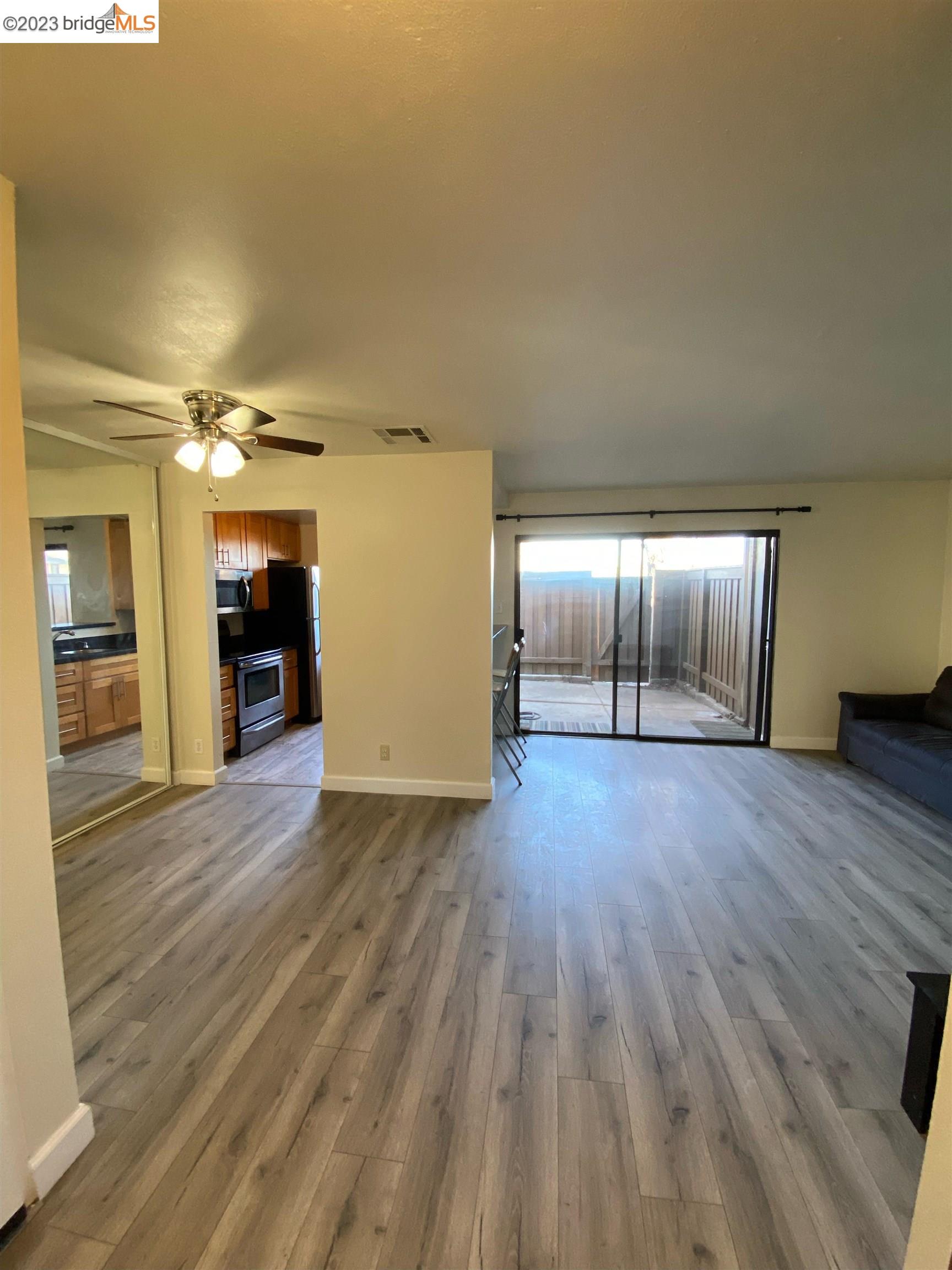2416 Shadow Lane, Unit 75 Antioch, CA 94509 - Photo 8 of 26 a view of an empty room and wooden floor