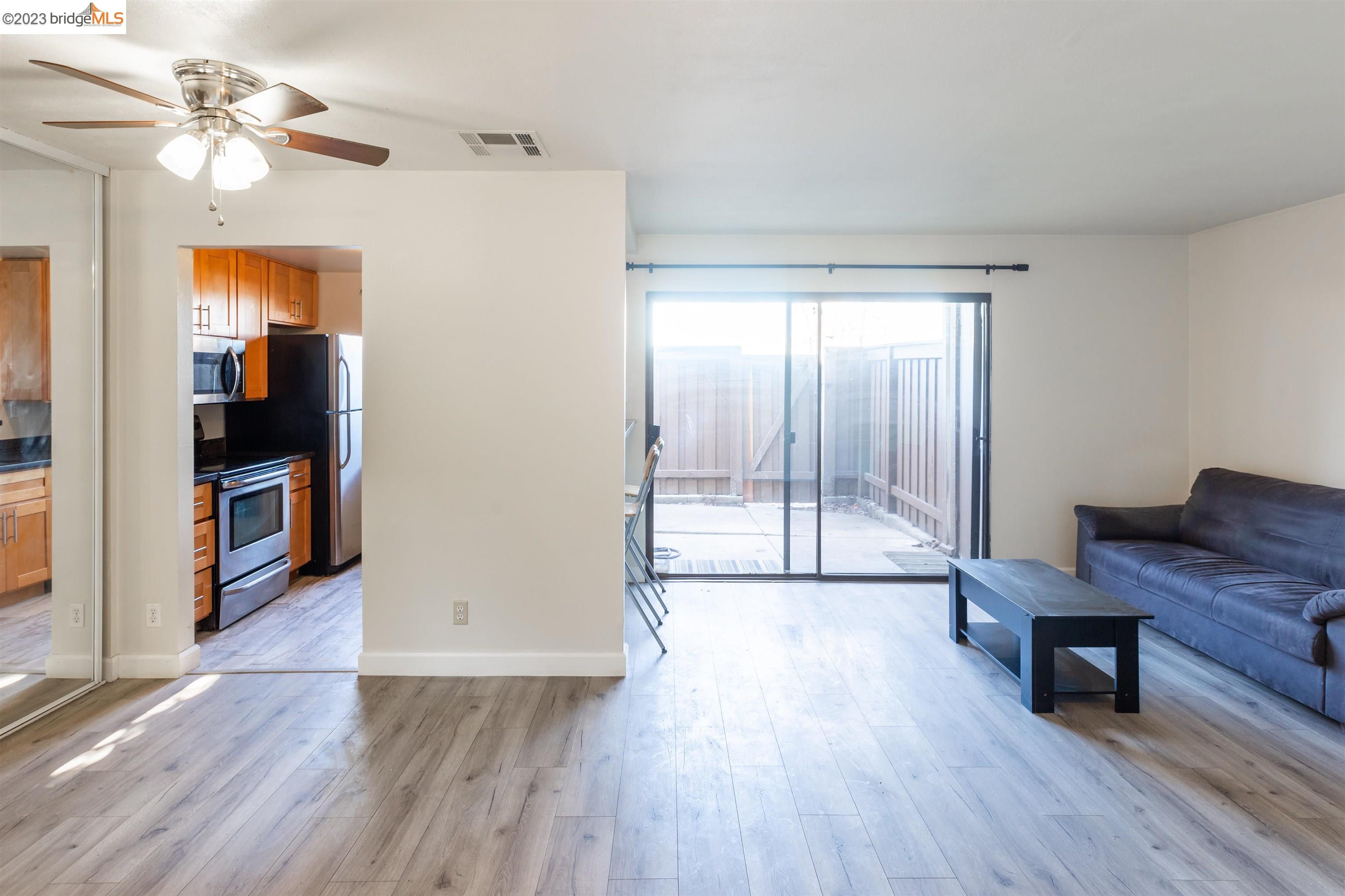 2416 Shadow Lane, Unit 75 Antioch, CA 94509 - Photo 10 of 26 a view of a room with wooden floor and cabinet