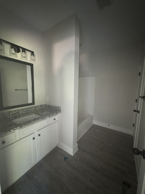 422 Shady Hill Road Dickson, TN 37055 - Photo 13 of 15 an empty room with wooden floor and mirror