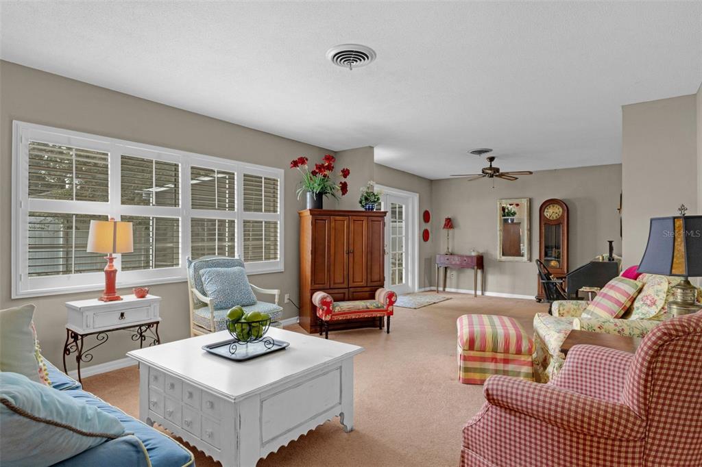 2774 Banchory Road Winter Park, FL 32792 - Photo 12 of 30 a living room with furniture and a flat screen tv