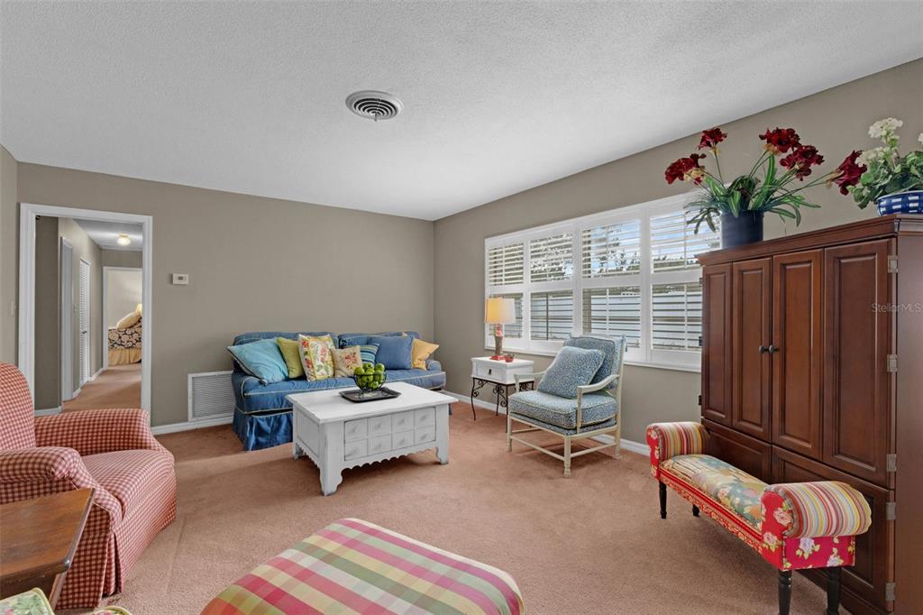 2774 Banchory Road Winter Park, FL 32792 - Photo 13 of 30 a living room with furniture and a potted plant