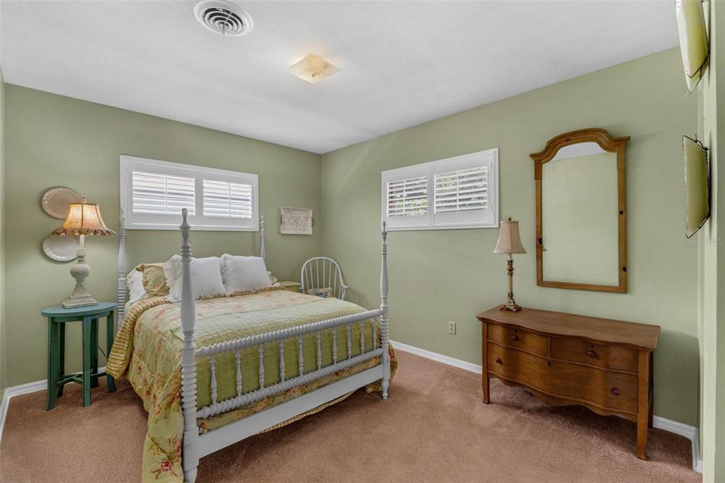 2774 Banchory Road Winter Park, FL 32792 - Photo 18 of 30 a bedroom with a bed and a dresser