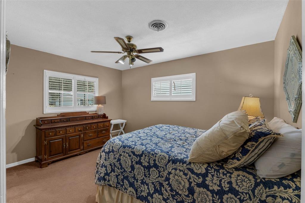 2774 Banchory Road Winter Park, FL 32792 - Photo 19 of 30 a bedroom with a bed and wooden floor