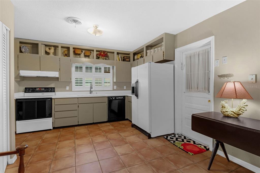 2774 Banchory Road Winter Park, FL 32792 - Photo 9 of 30 a kitchen with stainless steel appliances a refrigerator and a stove top oven