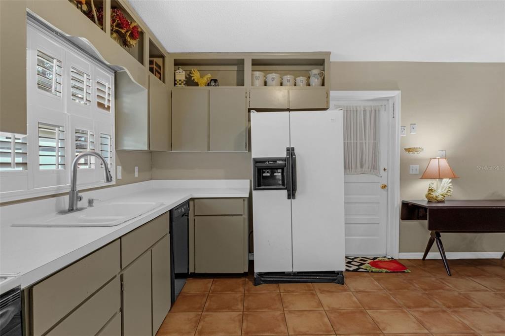 2774 Banchory Road Winter Park, FL 32792 - Photo 10 of 30 a kitchen with a refrigerator and a sink