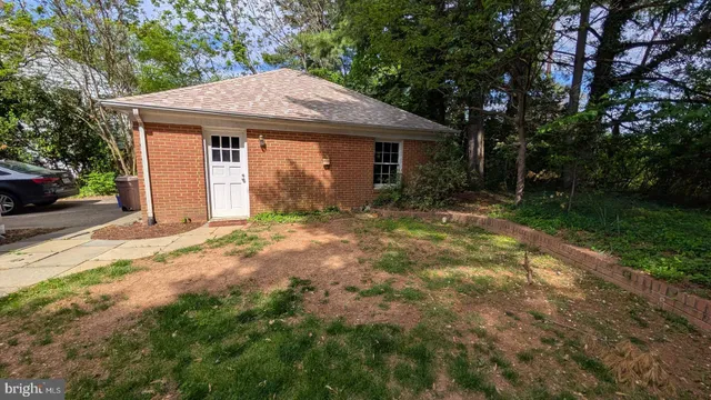 a view of a backyard with sitting area